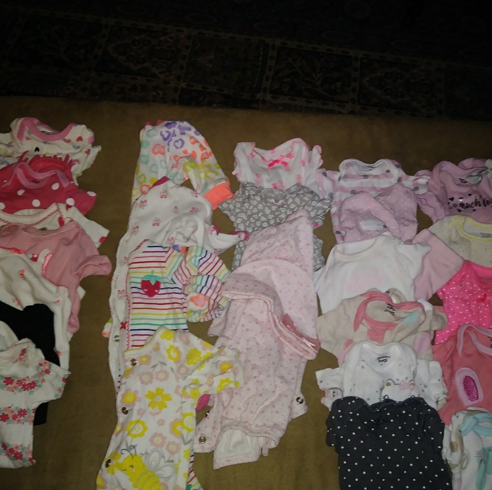 Lot of Preemie baby girl onsies and footies.